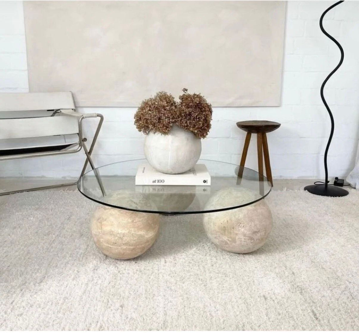 Round Glass Coffee Table on Travertine Spheres