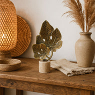 Brass Monstera Leaf Sculpture on Travertine