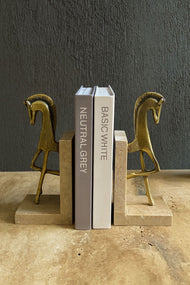 Brass Horse Bookends on Travertine