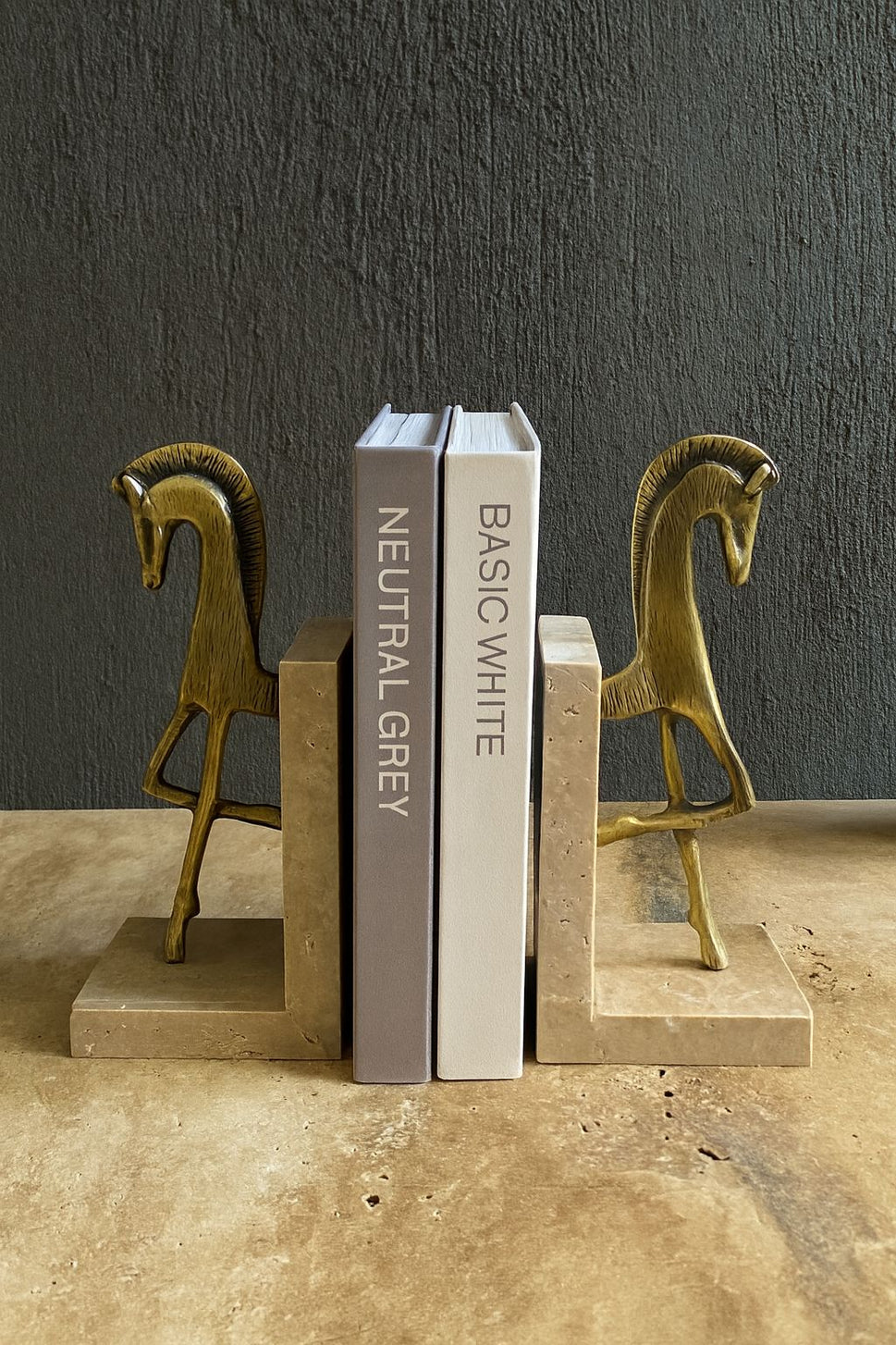 Brass Horse Bookends on Travertine