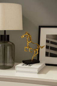 Gold Horse Sculpture on Black Marble