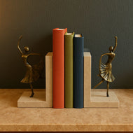 Brass Dancer Bookends on Travertine