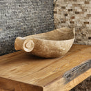 Switch Norhew luxury beige marble boat-shaped vessel sink with hand-carved scroll spiral edges on a natural oak vanity. 2 image
