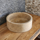 Switch Norhew luxury organic natural-shape travertine vessel sink with a weathered split-face exterior and a smooth honed interior. 3 image