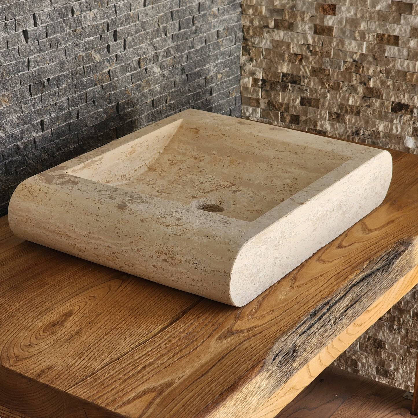 Norhew luxury rectangular travertine vessel sink with a sloped infinity interior and smooth radius-curved edges on a wooden vanity.