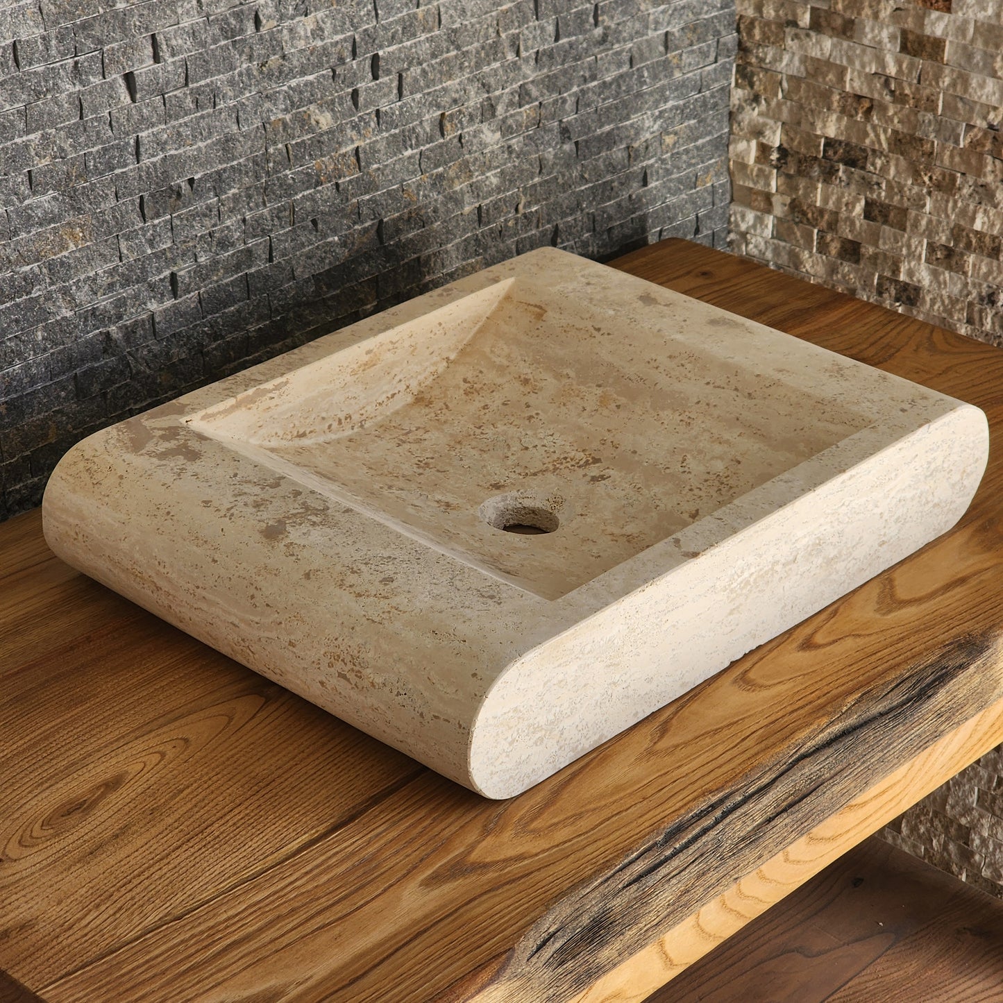 Norhew luxury rectangular travertine vessel sink with a sloped infinity interior and smooth radius-curved edges on a wooden vanity.