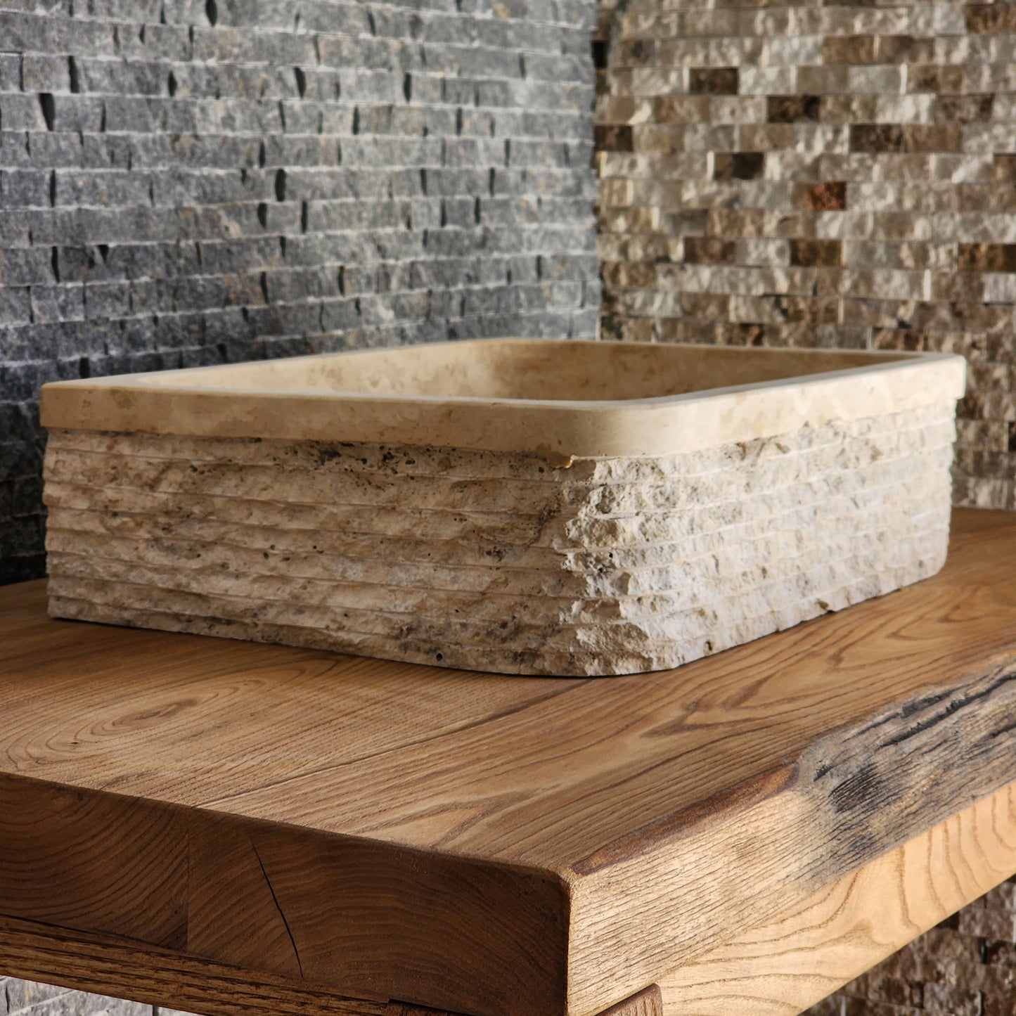 Norhew luxury D-shaped solid travertine vessel sink with a hand-chiseled texture on both the curved front and flat back side.