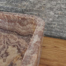 Switch Soft rectangle natural stone basin with rich rust and brown wavy onyx patterns on wood vanity. 2 image