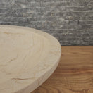 Switch Norhew luxury oval beige breccia marble vessel sink with a classic flared rim and intricate natural veining on a wooden vanity. 2 image