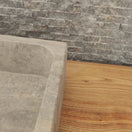 Switch Norhew luxury rectangular silver travertine vessel sink with a honed grey-beige finish and solid block silhouette on a wooden vanity. 2 image