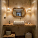 Switch A large Norhew rectangular vessel sink carved from natural travertine with a rugged chiseled exterior and a smooth, clean-lined interior basin. 2 image