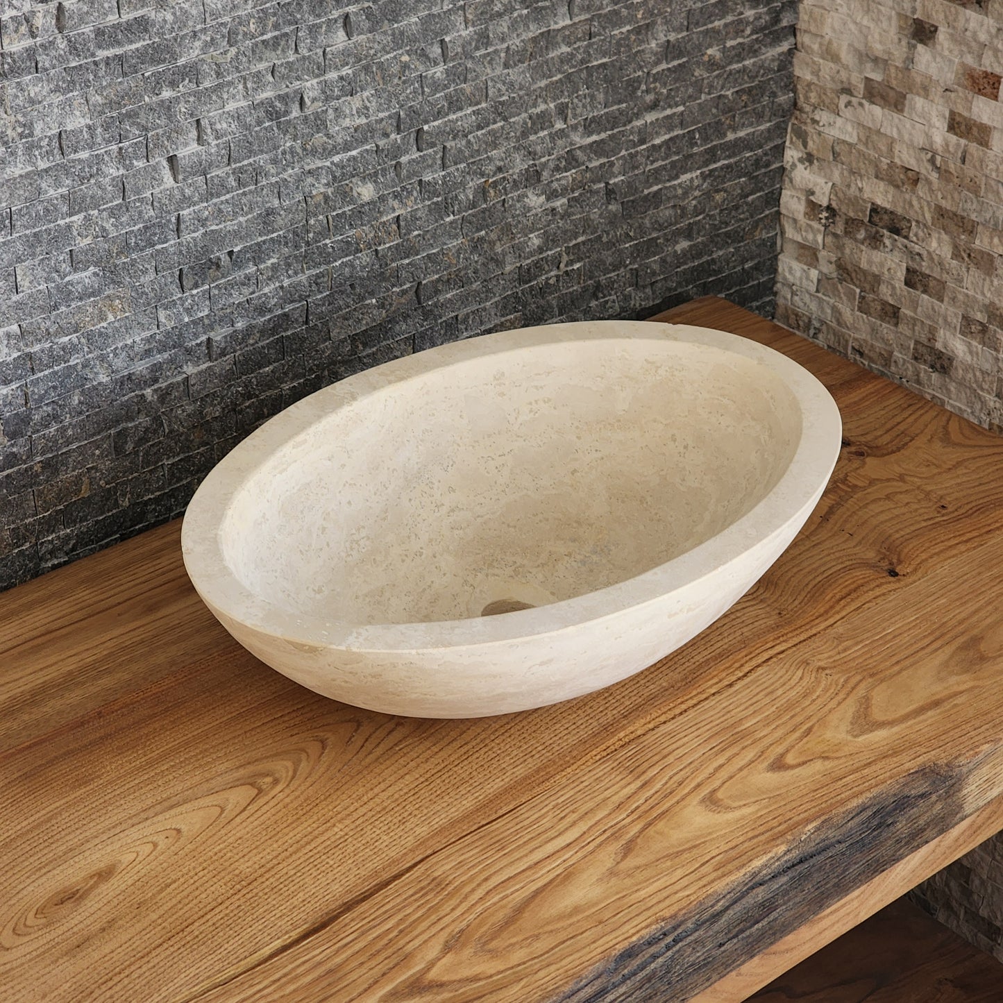 Norhew luxury round solid travertine vessel sink with natural golden-beige pitting and a thick-rimmed profile on a wooden vanity.