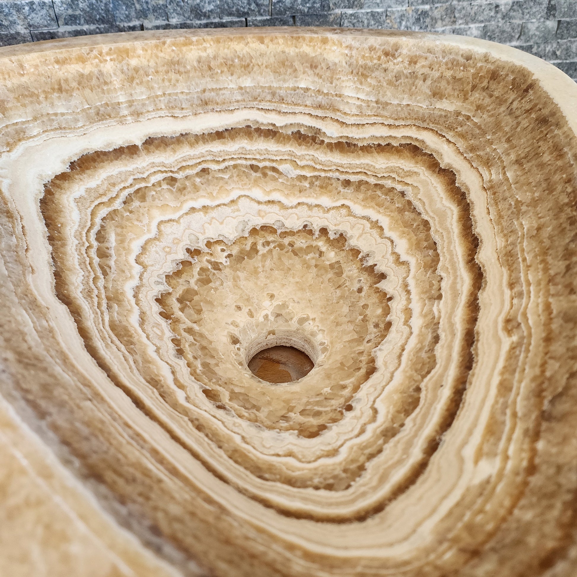 Triangular Exotic Onyx Vessel Sink - Hand-Carved Concentric Stone Basin